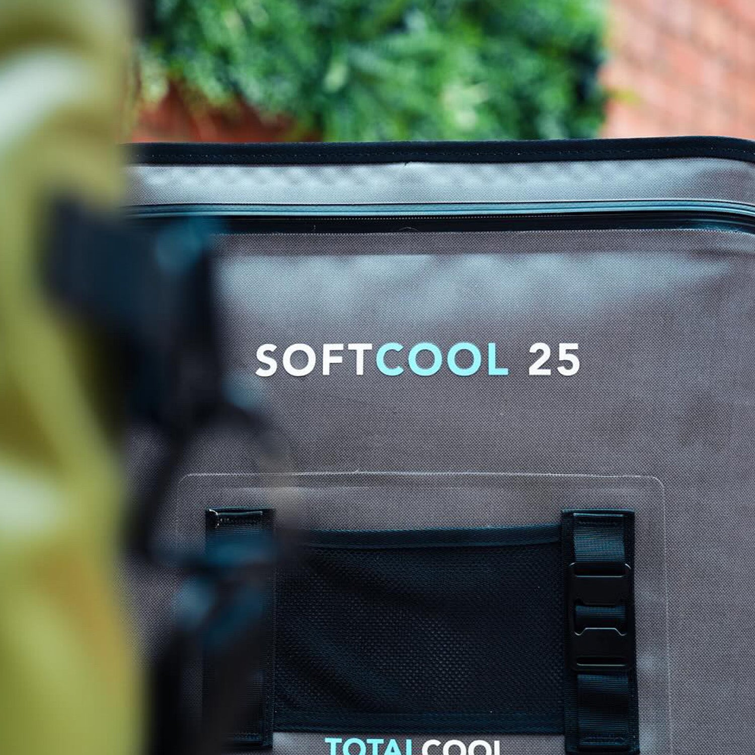 Close up image of the grey softcool 25 coolbag in an urban setting