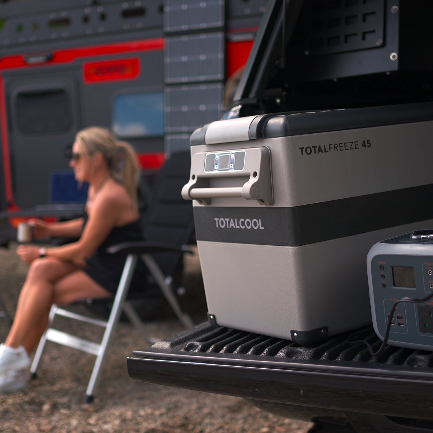 Image of the TF45 portable fridge freezer on the back of a vehicle being powered by a TP500 power bank