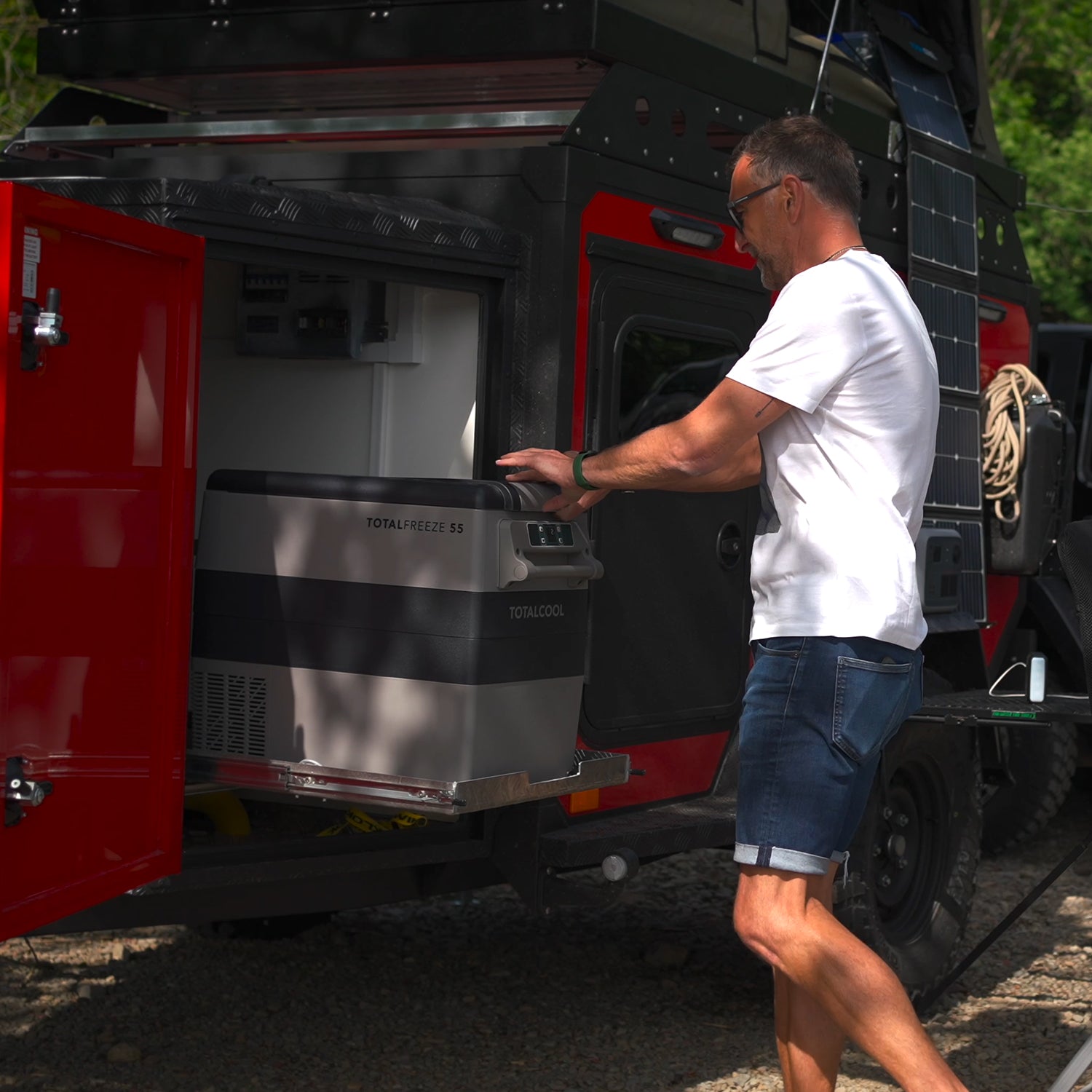 Image of the TF55 portable fridge freezer on a TF-Slide being conveniently packed away