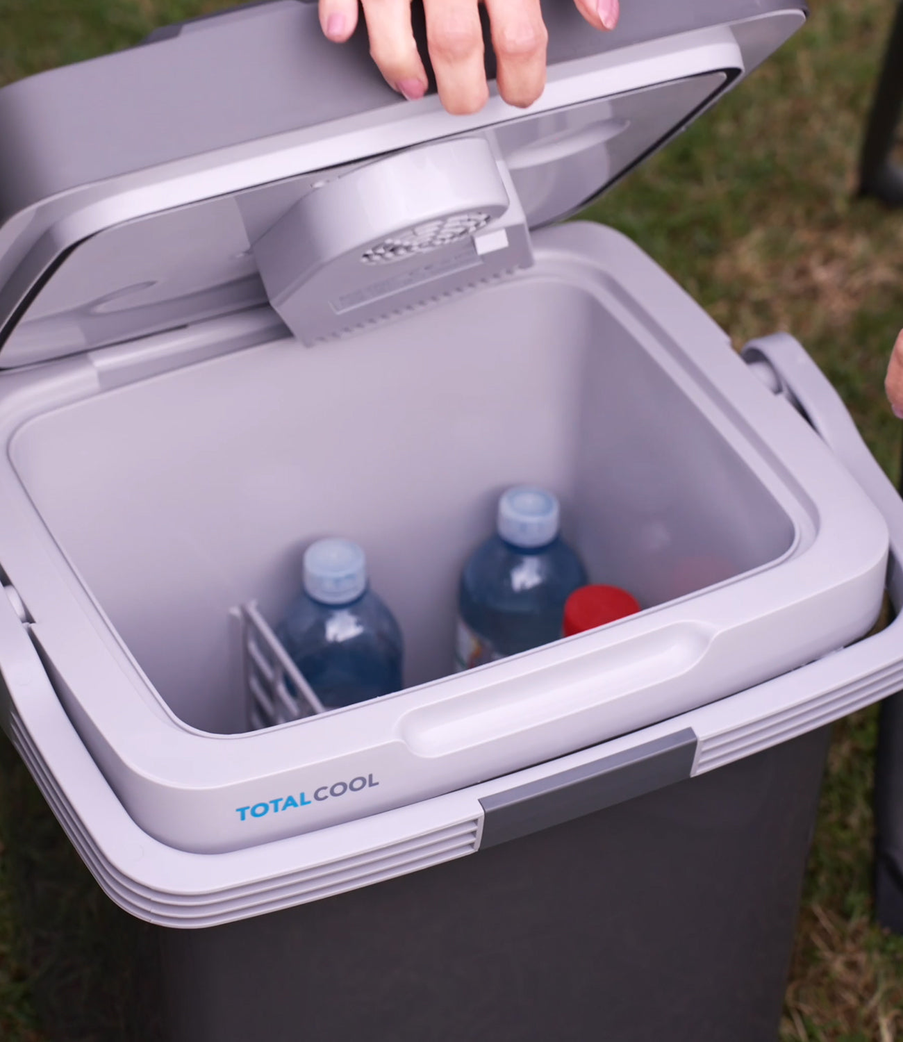 Image of the Eco-chill 24 grey cool box with the lid open and bottled contents on display