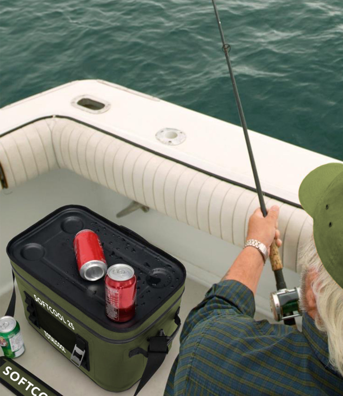 Image of an older man fishing with a softcool25 in his boat